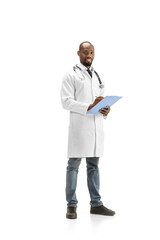 Paperwork. African-american doctor isolated on white background, professional occupation. Daily hard work for health and lives saving. Full length portrait. Medicine, healthcare, profession concept.