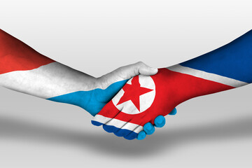 Handshake between north korea and luxembourg flags painted on hands, illustration with clipping path.