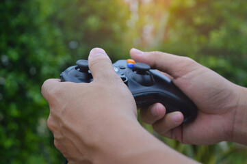 A man hand with a game joystick