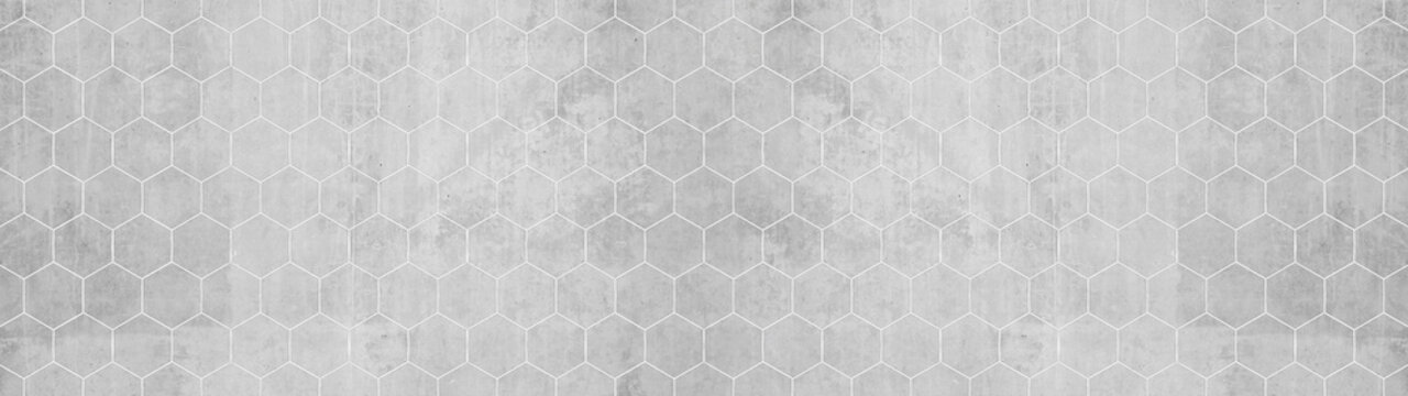 Abstract seamless white grey gray bright concrete cement stone tile wall made of hexagonal geometric hexagon print texture background banner panorama

