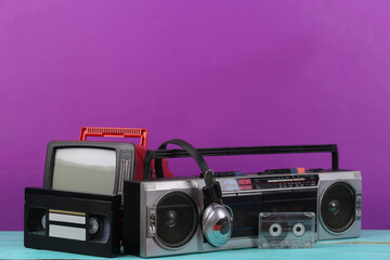 80s Retro outdated portable stereo radio cassette recorder, tv set, headphones, audio and video...