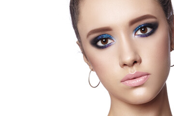 Fototapeta premium Beautiful Woman with Professional Makeup. Celebrate Style Eye Make-up, Perfect Eyebrows, Shine Skin. Bright Fashion Look
