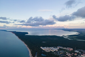 Drone view of whole curonian spit in the evening, spit between sea and gulf