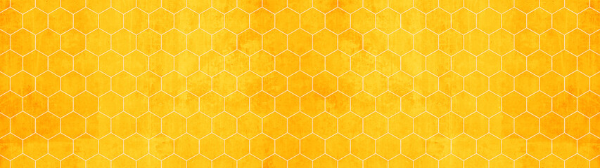 Abstract seamless yellow orange concrete cement stone tile wall made of hexagonal geometric hexagon print texture background banner panorama