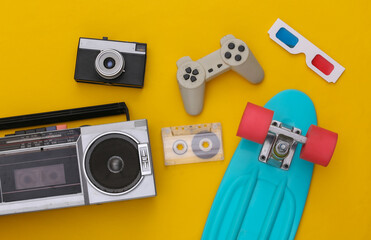 Retro old school attributes 80s on yellow background. Top view. Flat lay - obrazy, fototapety, plakaty