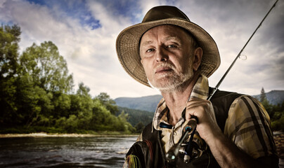 Fishing backgrounds. Old fisherman portrait.