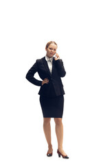 Talking phone. Young woman, accountant, finance analyst or booker in office suit isolated on white studio background. Caucasian woman, office worker. Finance, economy, professional occupation.