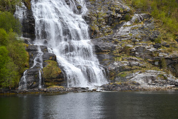 Falls in mountains of Norway in rainy weather. Norway waterfalls