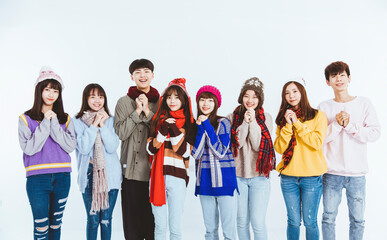 happy asian young people in winter clothes with Congratulations gesture for chinese new year