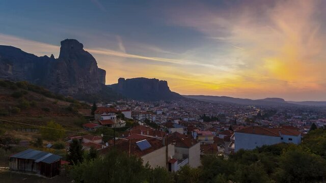Timelapse 4k, Incredible sunrise view of Meteora rock formation and Activities in morning city of Kalabaka, UNESCO World Heritage since 1988, Meteora, City Kastraki, Greece.