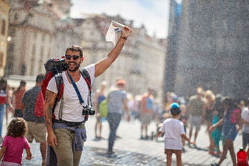 Man  traveling and enjoying summer at raining day.