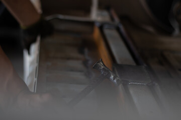 Worker,welding in a car factory with sparks, manufacturing, industry