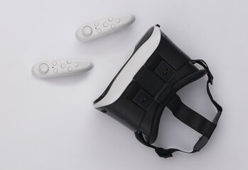 Virtual reality headset with joysticks on white background. Top view. Flay lay © splitov27