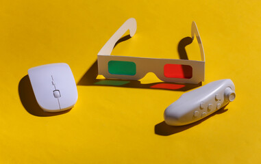 Anaglyph 3D glasses, pc mouse and joystick on yellow background with a shadow. Pop Art.