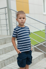 Happy cute smart boy with school bag. Modern backpack. First time at school. Back to school