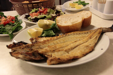 delicious fish and salads on presentation plate