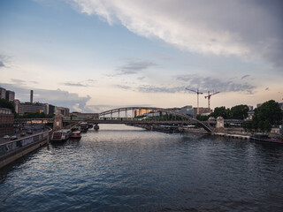 Metro passing by on the Charles de Gaulle bridge in Paris overlooking the river Seine