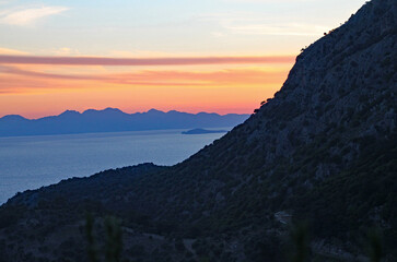 Fototapeta na wymiar A beautiful sunset over a lake and mountain in Turkey