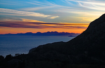 Fototapeta premium A beautiful sunset over a lake and mountain in Turkey