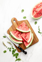 Watermelon slices lying on a cutting board