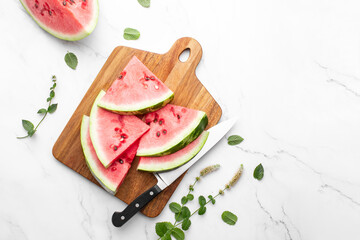 Watermelon slices lying on a cutting board