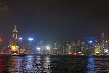 Obraz premium City landscape. Victoria Harbor and Hong Kong skyscrapers at night.