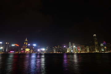 Fototapeta premium City landscape. Victoria Harbor and Hong Kong skyscrapers at night.