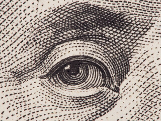 Founding father Benjamin Franklin eye super macro on us one hundred dollar bill, united states money closeup