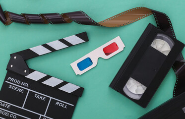 Retro Movie clapper board and video cassette, film, 3d glasses on mint color background....