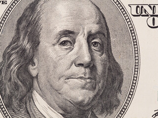 US 100 dollar bill fragment closeup, Benjamin Franklin face portrait, united states money