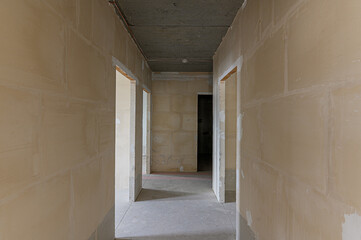 Russia, Moscow- February 15, 2020: interior room rough repair for self-finishing. interior decoration, bare walls of the premises, stage of construction