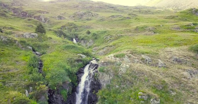 Low pass drone video over waterfalls in the french Alps Saint Francois Longchamp France