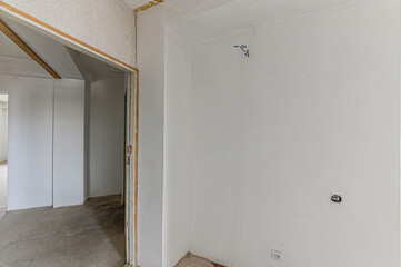 Russia, Moscow- February 15, 2020: interior room rough repair for self-finishing. interior decoration, bare walls of the premises, stage of construction