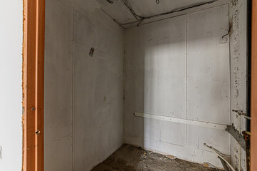 Russia, Moscow- February 15, 2020: interior room rough repair for self-finishing. interior decoration, bare walls of the premises, stage of construction