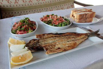 delicious fish and salads on presentation plate