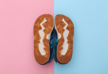 Sole running shoes (sneakers) on pink blue background. Healthy lifestyle. Top view