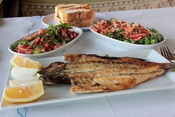 delicious fish and salads on presentation plate