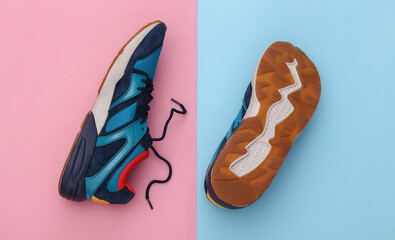 Running shoes (sneakers) on pink blue pastel background. Healthy lifestyle, fitness training. Top view