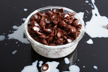 Chocolate Cereals Messy Milk in Black Background