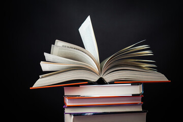 Open book on the table. It is time for education and therefore you need to go back to school.