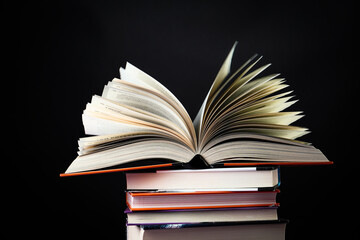 Open book on the table. It is time for education and therefore you need to go back to school.
