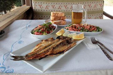 delicious fish and salads on presentation plate