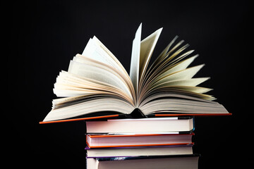Open book on the table. It is time for education and therefore you need to go back to school.