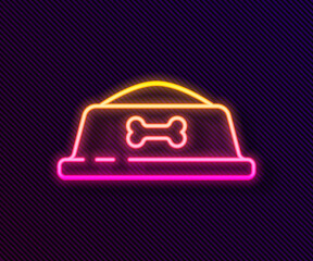 Glowing neon line Pet food bowl for cat or dog icon isolated on black background. Dog bone sign. Vector.