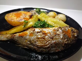 delicious fish and salads on presentation plate