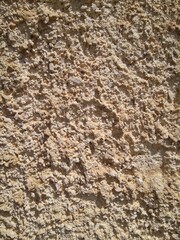 Sandstone wall structure, arbitrary masonry, close-up.