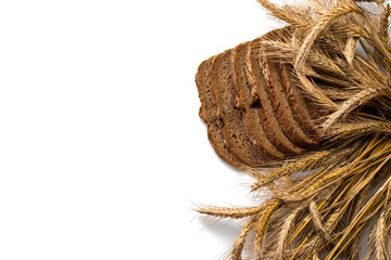 Rustic rye. Fresh loaf of rustic traditional bread with wheat grain ear or spike plant isolated on white background. Bakery with crusty loaves and crumbs. Design element for bakery product label.