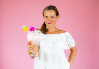 Beautiful woman smiling in white shirt showing a shake