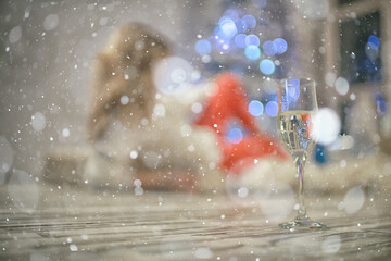 blurred background girl with champagne / new year and christmas party abstract background