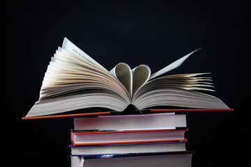 Open book on the table. It is time for education and therefore you need to go back to school.